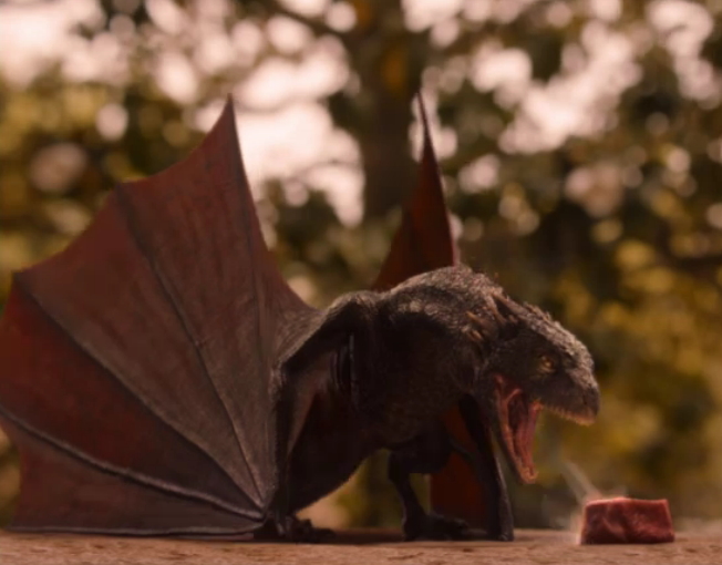 BITEY! Drogon roasting his meat.